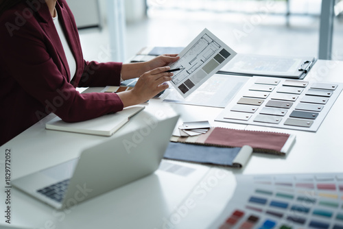 Interior designer selecting wood laminate for modern office