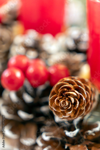 Natural decorations with pinecones, red berries, and candles set for a festive gathering