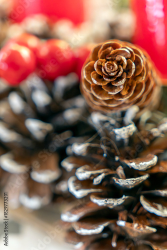 Beautifully arranged pinecones and decorative red objects for festive decor during the holiday season