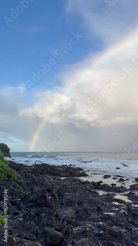 Morning rainbow over the ocean along the Kaanapali coastline on the west side of Maui in Hawaii. 
