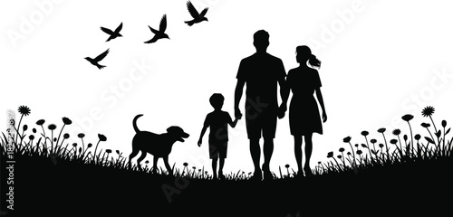 Loving family parents and child with pet dog walking together in a field with flying birds