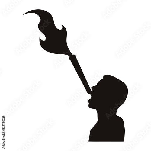 Silhouette of a performer spitting fire from a tube into the air