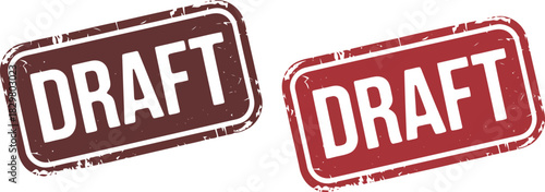 Two grunge style rectangular rubber stamps with the word DRAFT visible on a clean white background