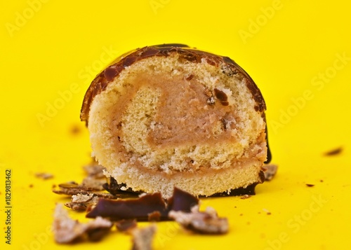 Mini Chocolate Cake Roll Swiss Roll on yellow background