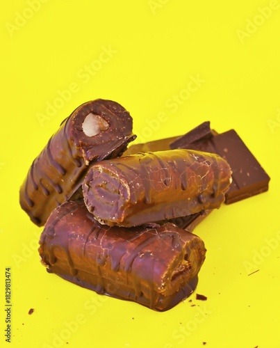 Mini Chocolate Cake Roll Swiss Roll on yellow background