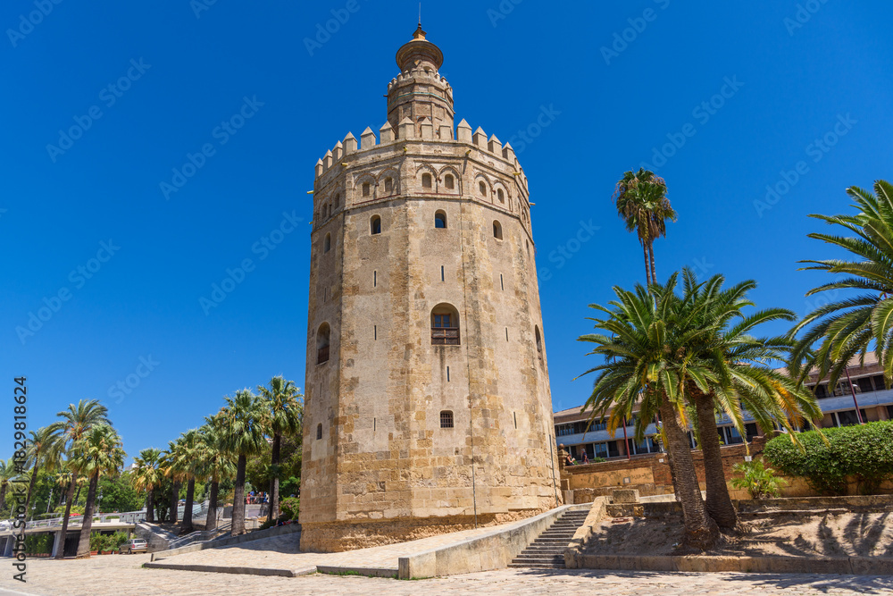 Fototapeta premium Sevilla, Spain - August 01, 2024: Golden tower Torre del Oro in Seville, Andalusia, Spain