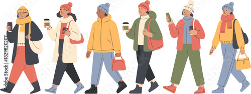 Diverse group of happy people walking together in colorful warm winter clothes on a cold day