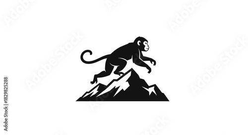Monkey silhouette leaping over mountain peak in black and white.