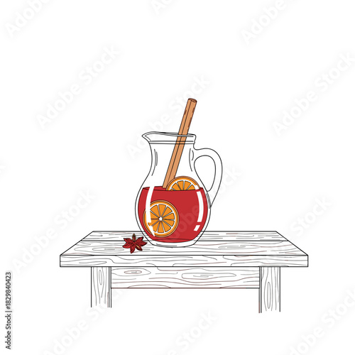 Jug of mulled wine with spices and orange slices on wooden table  