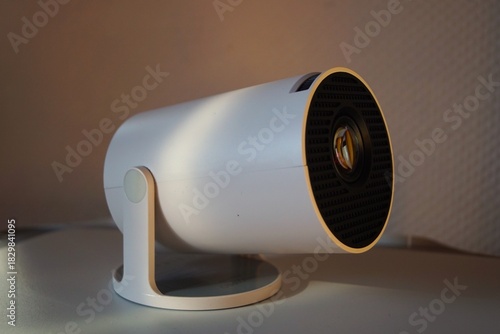 small white projector for showing videos
