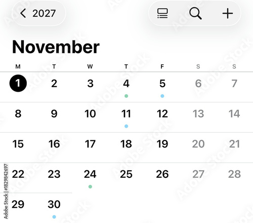 Digital November: A screen displays a user interface, highlighting the November 2027 calendar, days marked with dots, indicating events scheduled.