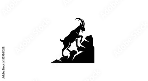 Silhouette of a Mountain Goat Climbing on Rocks.