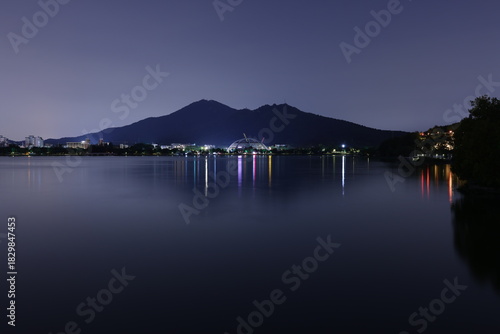 Long exposure night view of Zijin Mountain with lake reflection in Nanjing