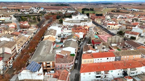 Aerial low altitude view of Tarazona rooftops bullring and rural landscape