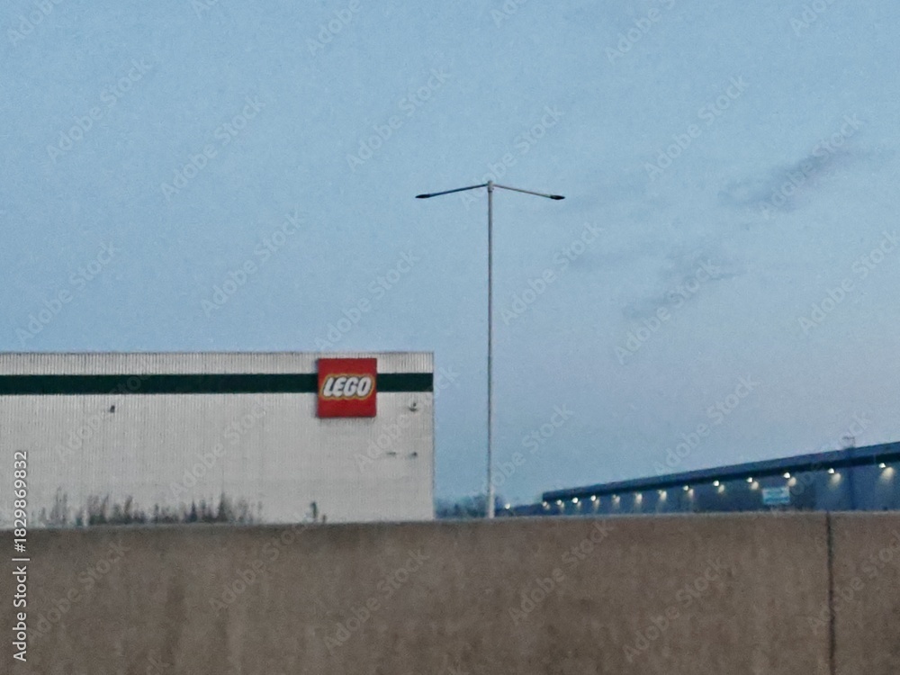 Fototapeta premium Prague,Czech Republic-May 6 2025: Exterior of LEGO Group’s large modern distribution center near Prague, key logistics hub for Central and Eastern Europe.