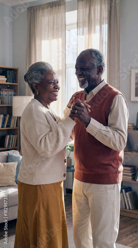 Vertical full body shot of a happy senior Black couple dancing slowly in a cozy living room, symbolizing everlasting love, active retirement and home wellbeing