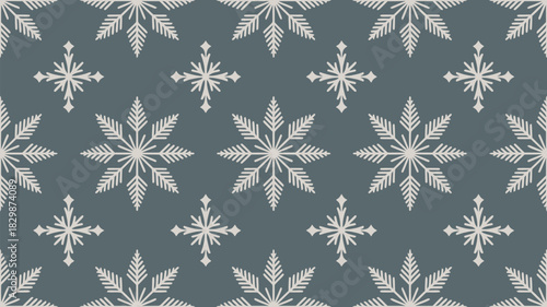 Seamless pattern of white snowflakes on a gray background creating a winter themed design repeatably