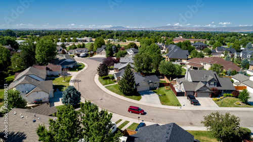 Small subdivision with homes and a red minivan