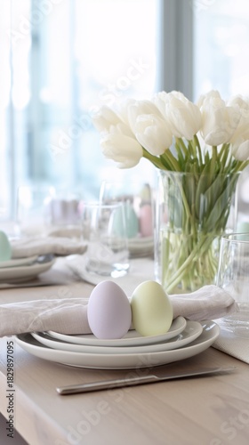 Eggs and flowers on a table in front of a vase.