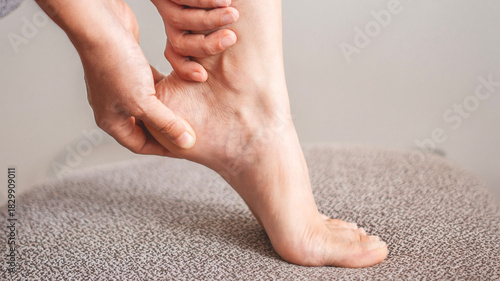 Foot pain, woman suffering from feet ache