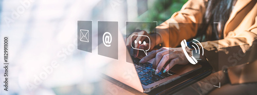 Digital Customer Communication & Support Interface, A modern business communication, Person typing on a laptop with floating digital icons representing email, messaging, phone, online contact methods.