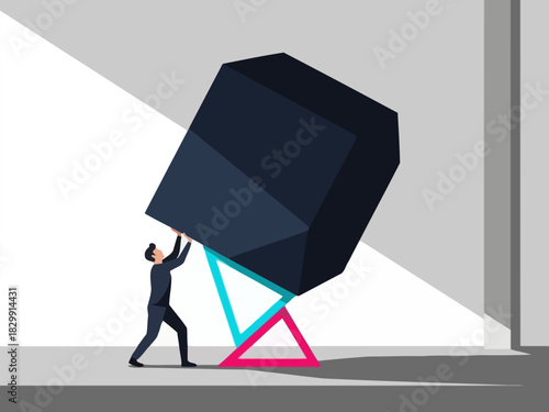Business metaphor of a man holding up a heavy cube balanced on fragile triangles.
