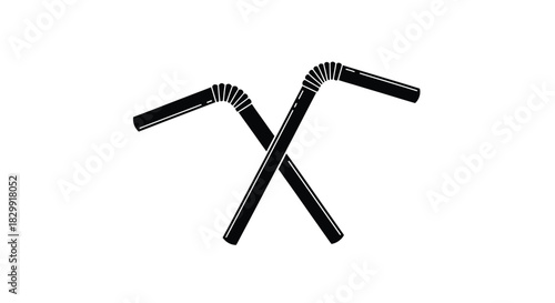 Two black flexible drinking straws crossing each other in an x shape