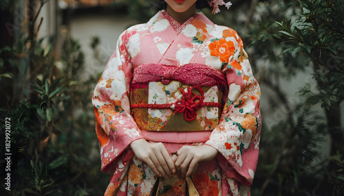 Wallpaper Mural A woman wearing a traditional Japanese kimono with pink and orange patterns Torontodigital.ca