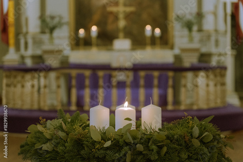 Advent Wreath with Burning Candle in Front of Church Altar During Liturgical Season