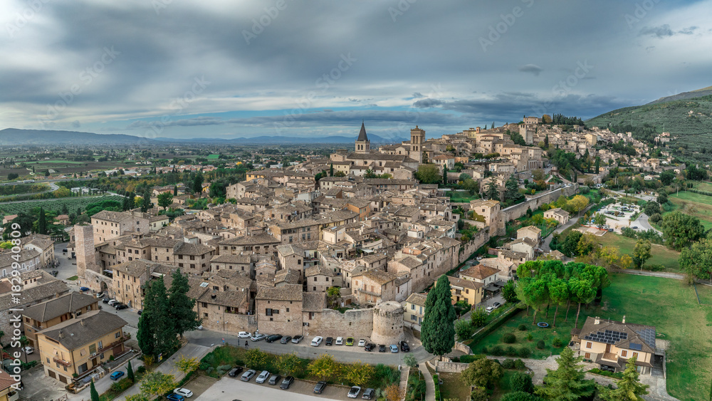 Fototapeta premium Aerial view of Spello enclosed in a circuit of medieval walls built on Roman foundations, including three Roman Late Antique gates