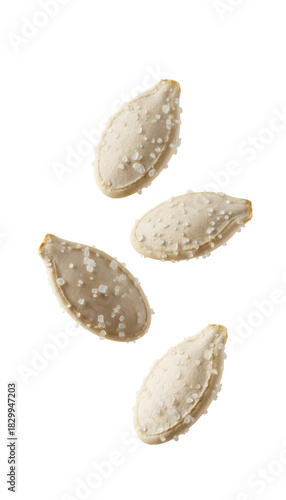Salted pumpkin seeds falling on transparent background