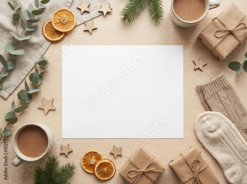 Cozy winter flat lay with coffee, gifts, and blank paper on a wooden table