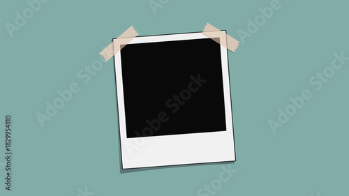 A blank polaroid picture taped to a light blue wall with two pieces of tape at the top corners