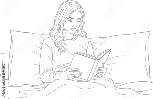 Young woman engrossed in a book while comfortably resting in bed