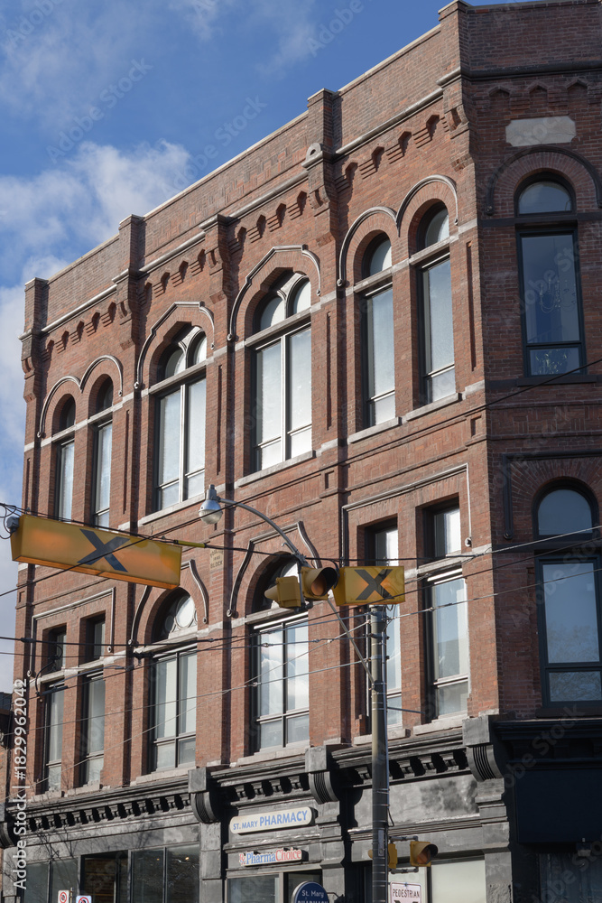 Obraz premium old building facade of Poulton Block on Queen St E, Toronto (originally: Orient Hall Masonic Lodge, 1886, 792 Queen E