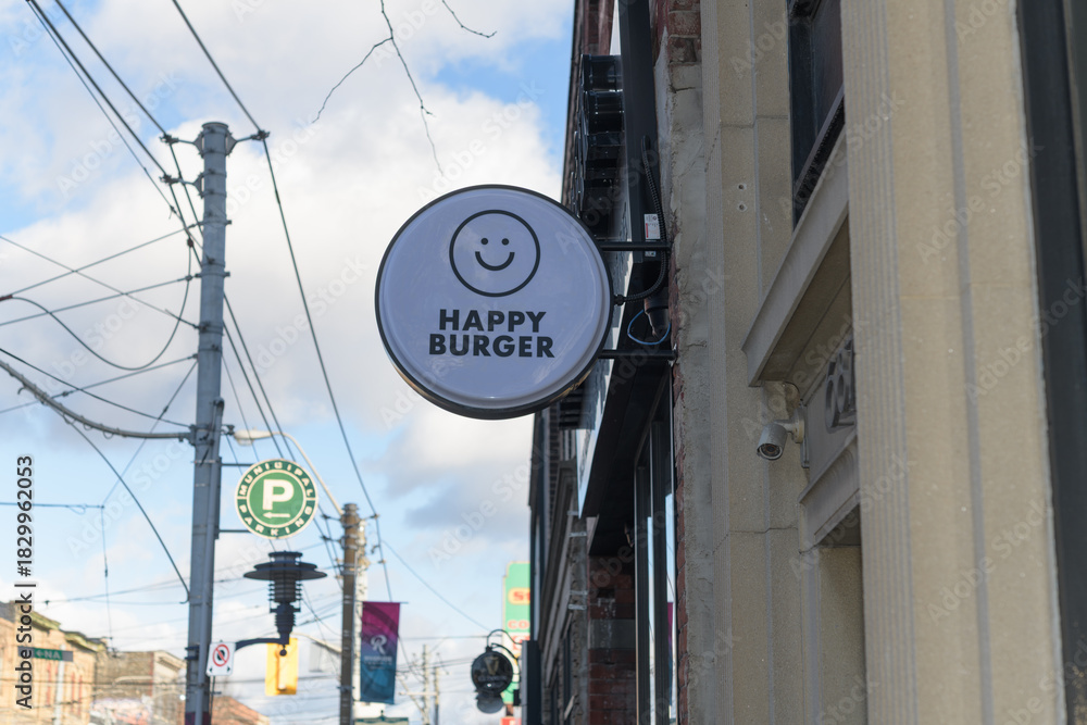 Obraz premium round projecting sign outside Happy Burger - 689 Queen St. East, Toronto