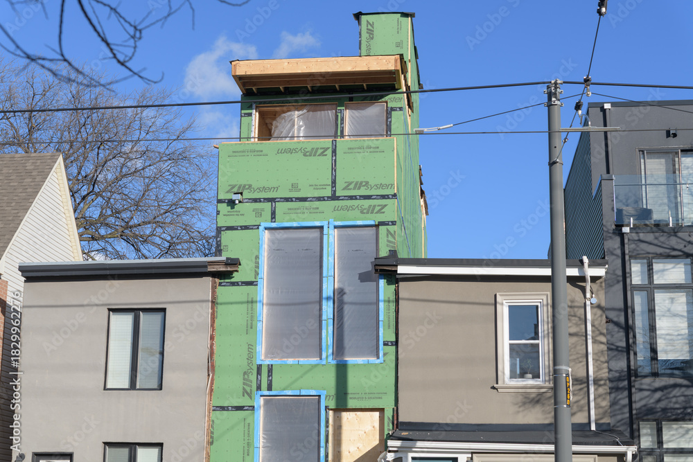 Obraz premium slim house under construction at 67 Leslie St, Toronto