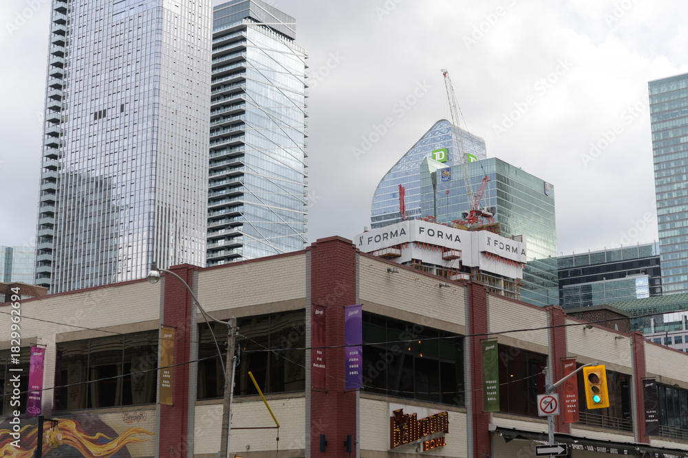 Obraz premium (bottom) The Ballroom Bowl (left) Thomson Reuters, condo, TD Terrace, and Forma under construction seen from John and Richmond, Toronto