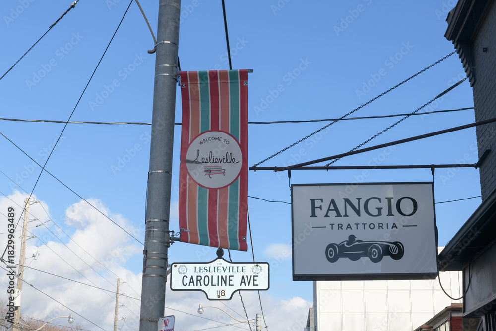 Fototapeta premium projecting banner at Leslieville and Fangio Trattoria at Caroline and 1111 Queen St E, Toronto