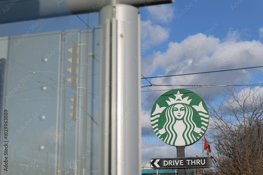 Obraz premium Starbucks Mermaid logo sign at 23 Leslie St, Toronto