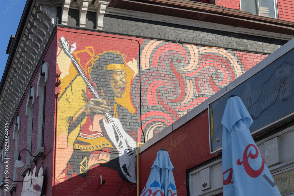 Fototapeta premium mural on the west facing wall of The Duke, a bar, located at 1225 Queen St E, Toronto