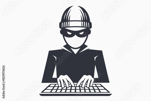 Silhouette depicts a focused man wearing a beanie typing on a computer keyboard