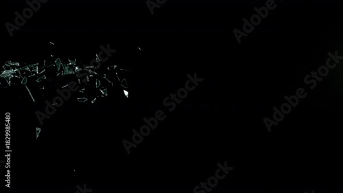 Super Slow Motion Shot of Real Side-Flying Glass Shards Isolated on Black at 1000 fps.