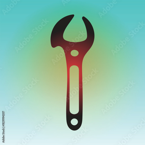 Red and black wrench tool on a green background for construction work