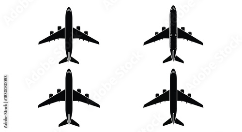 Four black silhouettes of commercial airplanes viewed from directly above
