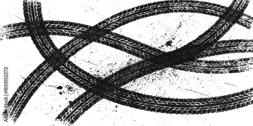 Grungy black tire marks crossing with dirt splatters on white isolated on white background