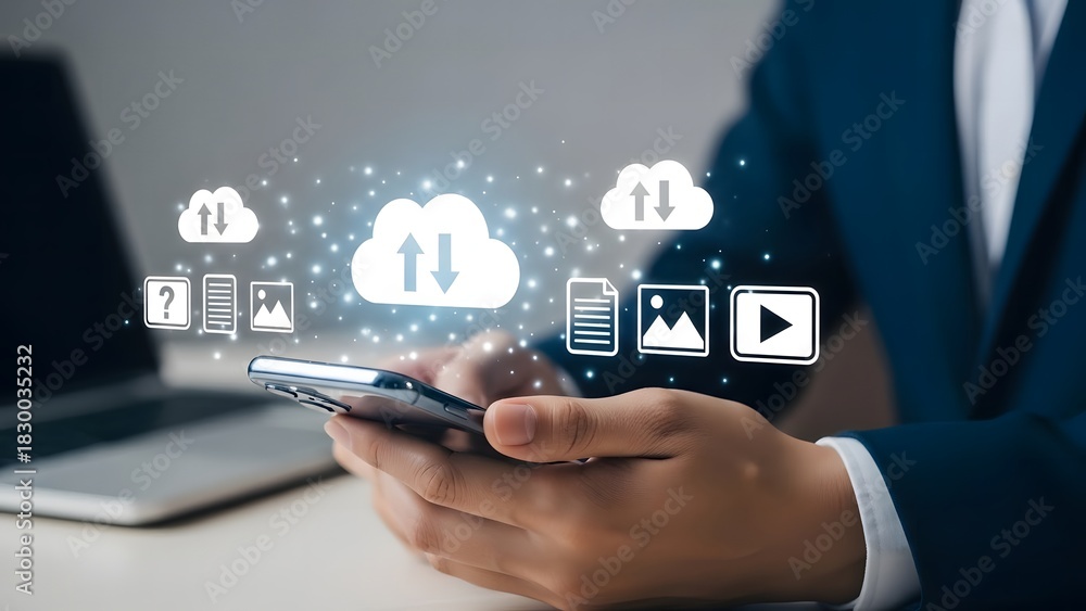 Naklejka premium Businessman using cloud computing technology on smartphone for data storage