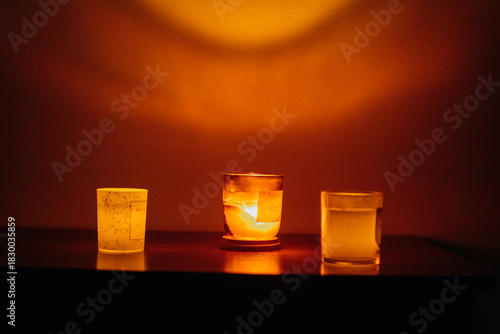 The lights and electricity in the apartment are turned off. Candles are burning brightly.