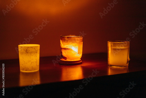 The lights and electricity in the apartment are turned off. Candles are burning brightly.