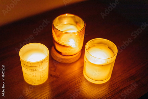 The lights and electricity in the apartment are turned off. Candles are burning brightly.